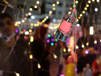 A Palestinian shopkeepers sells lanterns ahead of the fasting month of Ramadan, in Gaza City, on April 11, 2021, amid the coronavirus pandem...