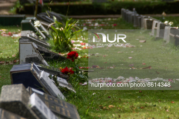 Flowers is seen lies on the cemetery during a Nyadran ritual on 12, April, 2021 at Cibarunai Tomb in Bandung, Indonesia. Before the month of...