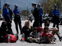 Refugees and migrants protest at the Asylum service in Athens, Greece demanding asylum and papers on April 12, 2021. (