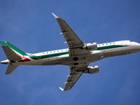 Alitalia Cityliner Embraer ERJ-175 aircraft as seen during takeoff and flying from Amsterdam AMS EHAM Schiphol airport to Italy. The regiona...