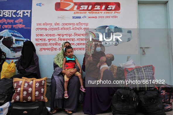 People leave the city as Bangladesh authorities ordered an eight-day lockdown to contain the spread of the Covid-19 coronavirus, in Dhaka on...