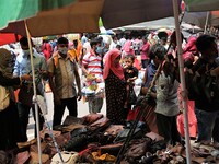 People gather at Dhaka New market for shopping as they not maintaining any kind of social distance in Dhaka, Bangladesh on April 12, 2021. (