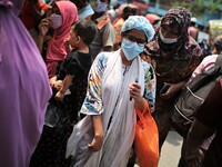People gather at Dhaka New market for shopping as they not maintaining any kind of social distance in Dhaka, Bangladesh on April 12, 2021. (