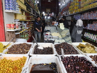 Syrians shopping for the month of fasting at a popular market in the city of Idlib, northwestern Syria on April 12, 2021. Several Arab and I...