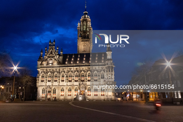 Illuminated iconic Middelburg Town Hall, one of the main monument attractions of the city sightseeing, a landmark of architecture as seen af...