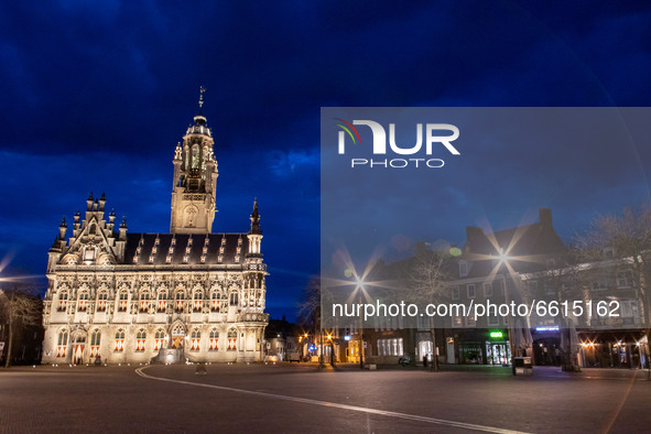 Illuminated iconic Middelburg Town Hall, one of the main monument attractions of the city sightseeing, a landmark of architecture as seen af...