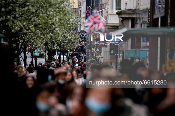 Shoppers pack Oxford Street in London, England, on April 12, 2021. Coronavirus lockdown measures were further eased across England today, wi...