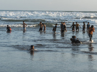 Indonesians taking a dip on the beach as part of the traditional ritual called Padusan to welcome the holy month of Ramadan at Parangtritis...