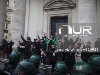  Anti riot police officers confront protesters during a demonstration organised by the 'IoApro' (I open) movement  against restriction measu...