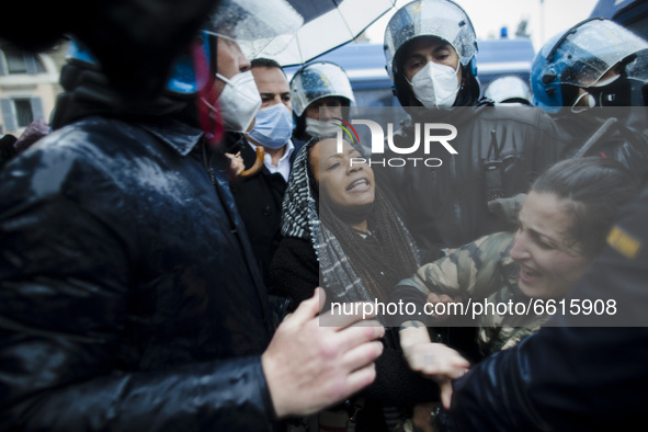  A demonstrator is being detained  during a demonstration organised by the 'IoApro' (I open) movement  against restriction measures to curb...