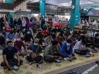 Indonesian Muslims seen gathered to break their fast during the first day of Ramadan at Jogokariyan Mosque in Yogyakarta, Indonesia on April...