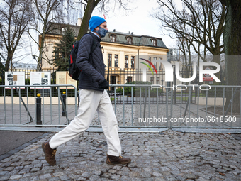 A man wearing a face mask is seen walking past the Constitutional Tribunal in Warsaw, Poland on April 13, 2021. On Thursday the Constitution...