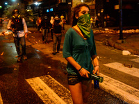 Demonstrators continue violent confrontations with National Guards on the streets of Chacao, Caracas, Venezuela, on March 27, 2014 as anti-g...