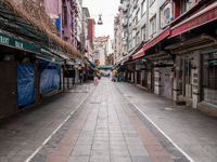 Almost deserted street as seen in a market and residential area near the Kadikoy district of Istanbul, Turkey on the first day of fasting fo...