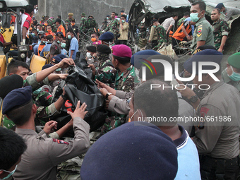 Indonesian military officers to evacuate the casualty Hercules C-130, in Medan, North Sumatra, Indonesia on June 30, 2015. An Indonesian mil...
