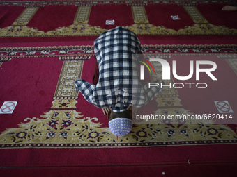 A Nepalese little boy offer Ritual Prayer on the first Friday of Ramadan maintaining social distance during covid pandemic at Kashmiri Jame...