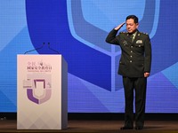 The Commander of the Chinese People's Liberation Army Hong Kong Garrison, Major General Chen Daoxiang, salutes before speaking during the op...