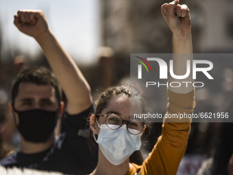 Students wearing protective face masks hold a banner during a demonstration against government plans to set up a university police, amid the...
