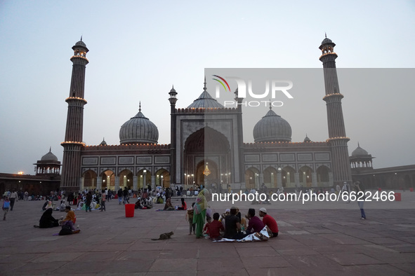Muslims wait to break fast (iftar) during the holy month of Ramadan, amidst the spread of the coronavirus disease (Covid-19), at Jama Masjid...