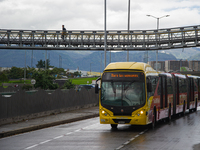 A view of a Transmilenio bus with the message 