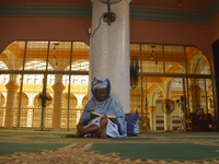 A Muslim woman read Quran at the Lagos Island Central Mosque, on the first Friday of the holy fasting month of Ramadan in Lagos, Nigeria, on...