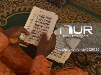 A Muslim man read Quran at the Lagos Island Central Mosque, on the first Friday of the holy fasting month of Ramadan in Lagos, Nigeria, on A...