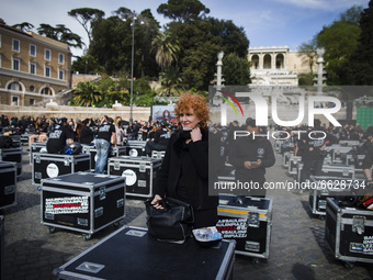 Singer  Fiorella Mannoia takes part in a flash mob performance called by the 'Bauli in Piazza' movement against the lack of aid to the cultu...