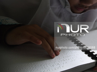 Blind people read the Braillle Quran together (tadarus) at the Raudlatul Makfufin Foundation in Tangerang, Banten, on April 19,2021. The rea...