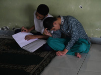 Blind people read the Braillle Quran together (tadarus) at the Raudlatul Makfufin Foundation in Tangerang, Banten, on April 19,2021. The rea...