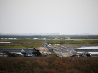 The destroyed remains of exploded Starship prototype SN11 across the road from the launch site on the morning of Tuesday, April 20th, 2021 i...