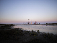 Starship SN15 is prepared for static fire and launch at  SpaceX's South Texas build site as the sun sets on April 20th, 2021 in Boca Chica,...