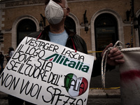 Alitalia workers stage a protest on Piazza Venezia in Rome on April 21, 2021 to demand more state help for the beleaguered Italian airline a...