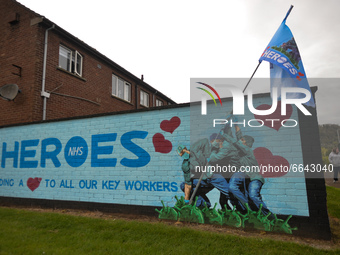 An Iwo Jima Memorial inspired NHS Heroes Mural by artists Ricky Morrow and Dee Craig in the village of Glynn near Larne, in County Antrim.
O...