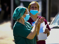 Doctors and hospital staff demonstrate, amid the coronavirus disease (COVID-19) pandemic, in Athens, Greece, April 22, 2021. (