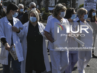 Doctors and hospital staff demonstrate, amid the coronavirus disease (COVID-19) pandemic, in Athens, Greece, April 22, 2021. (