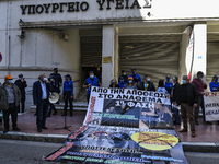 Doctors and hospital staff demonstrate outside the Health Ministry, amid the coronavirus disease (COVID-19) pandemic, in Athens, Greece, Apr...
