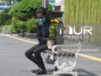 Environmental activists staged an action using plant oxygen to commemorate Earth Day 2021 at Jalan MH Thamrin, Jakarta, onApril 22, 2021.The...