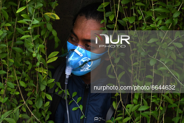 Environmental activists staged an action using plant oxygen to commemorate Earth Day 2021 at Jalan MH Thamrin, Jakarta, onApril 22, 2021.The...
