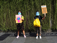 Environmental activists hold a dance action to commemorate Earth Day 2021 at Jalan MH Thamrin, Jakarta, at April 22, 2021.The dance action o...