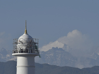 A view of newly constructed historic Dharahara tower along with Mount Langtang ranges seen after a heavy rainfall inside Kathmandu Valley in...