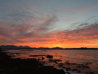 View of the sun rising over Inishnee Island on Roundstone Bay seen from Roundstone Harbor.
On Wednesday, 23 April 2021, in Roundstone, Irela...