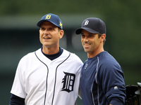 University of Michigan's head football coach, Jim Harbaugh talks with Detroit Tigers manager Brad Ausmus after throwing out the first pitch...