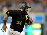 Pittsburgh Pirates' Pedro Alvarez scores a run on a sacrifice fly to fielder by Jordy Mercer in the third inning of a baseball game against...