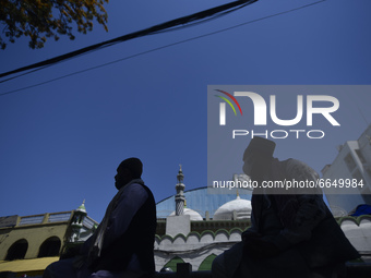Nepalese Muslims stuck outside as arrive for the Friday's ritual prayer of Ramadan at Kashmiri Jame mosque at Kathmandu, Nepal on Friday, Ap...