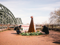 people lay the flowers to the monument of Armenian genocide in Cologne, Germany on April 24, 2021.  (