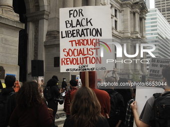A protester calls for the liberation of all black people through socialism during a rally calling for the release of Mumia Abu-Jamal and all...