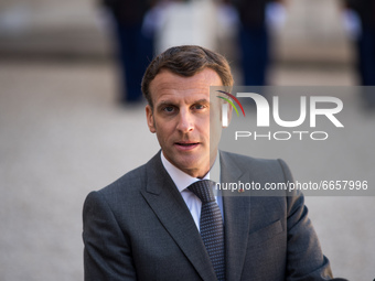 French President Emmanuel Macron addresses a press conference in the Elysee court during the France-Germany bilateral summit, together with...