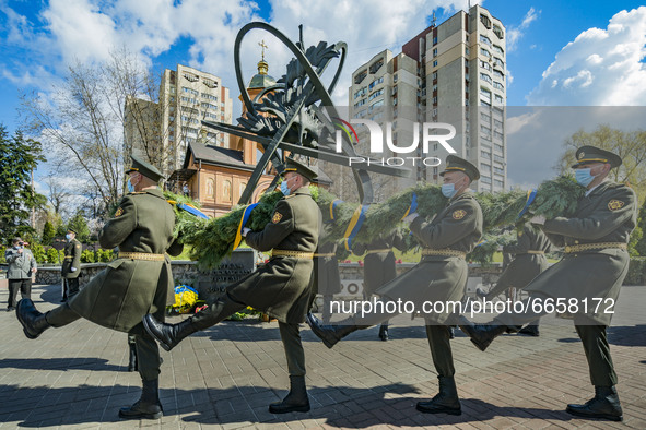 Soldiers march with a flower tribute during the celebrations in Kiev, Ukraine, on April 26, 2021 of the 35th anniversary of the Chernobyl  n...