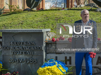 A Chernobyl liquidator poses for a photo  in the memorial site about the Chernobyl catastrophe during the celebrations in Kiev, Ukraine, on...