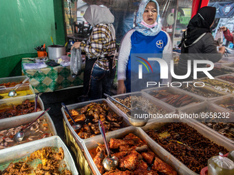 Daily life at Cinere, Depok, West Java, Indonesia, on April 26, 2021 when people buying food in preparation breaking fasting during holy mon...